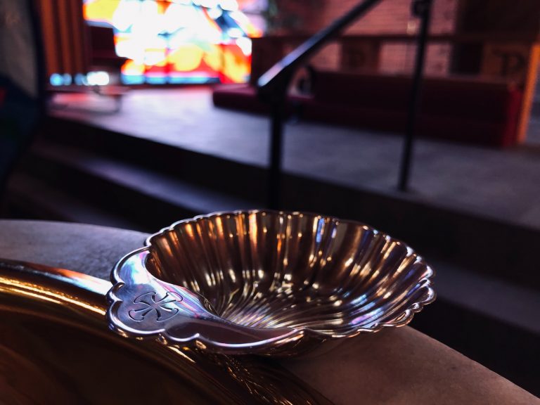 stainless steel round bowl on table